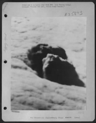 Thumbnail for Consolidated > This is the first photograph released showing results of instrument bombing by 12th A.F. North American B-25 Mitchells. Attacking in spite of weather completely concealing their target, a German Ammunition Dump at Spilimbergo, Italy, about 55 miles