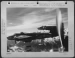 Thumbnail for This is 12th Air Force North American B-25 number 13, but all the bad luck is neatly packed in each of the 1,000 pound bombs headed for the Brenner Pass Line bridge below. The link, located at Staz di Ceraino 15 miles northwest of Verona, was damaged - Page 1