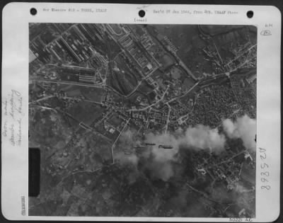 Consolidated > They ride on smoke---Drifting down on grey smoke from fires started by previous explosives, six bombs fall from the bays of North American B-25 Mitchell bomber in a raid on Terni, Central Italy, on 2 Jan. The targets, well covered, were the city's