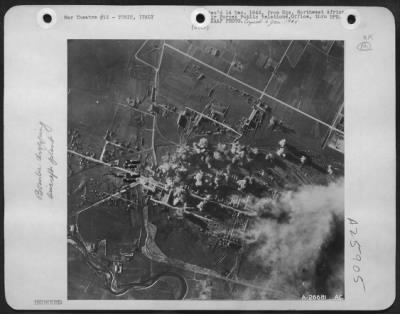 Thumbnail for Consolidated > AAF B-17 bombs plaster the entire southern part of the Turin ball bearing works area. Shown here are direct hits on the southern approach of the Linetto marshalling yards, left; other direct hits on shops in the southern area of motor and aero engine