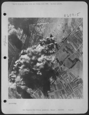 Consolidated > As the bombers turn for home, the Aiming Point on Udine Airdrome is covered with bomb-burst smoke, billowing up thousands of feet high.