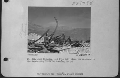 Consolidated > Lt. Colonel Jack Nickolas, A-2 15Th A.F. Views The Wreckage In The Marshalling Yards In Roverto, Italy.