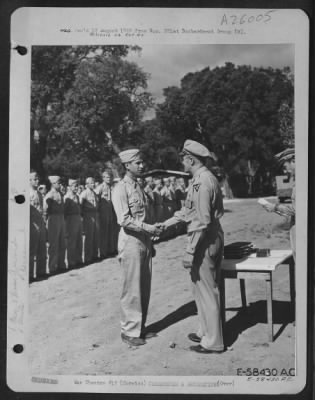 Consolidated > Brig. Gen. Robert Knapp presents awards at the 321st B.G. Organization Day on 1 August 1944 at Solenzara, Corsica.