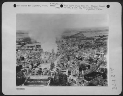 Thumbnail for Argentan > Argentan, France two hours after Amerian forces made their first entry. 9th Air Force tactical reconnaissance photographer records fires burning in the heart of the city which were set by the Germans as the retreated.