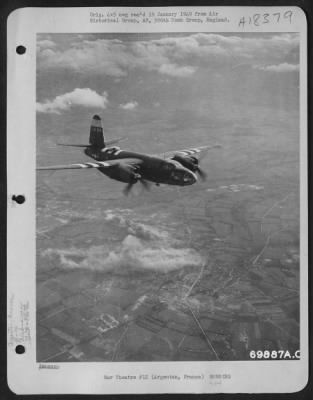 Thumbnail for Argentan > Bombs, Dropped By A Preceding Formation Of Martin B-26 "Marauders" Explode As The B-26 'Sexy Betsy' Flies Over Argentan, France During A Raid On 14 June 1944.  386Th Bomb Group.