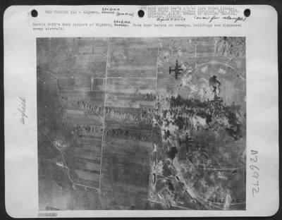 Thumbnail for Consolidated > Martin B-26's Bomb Airport at Alghero, Sardinia. Note bomb bursts on runways, buildings and dispersed enemy aircraft.