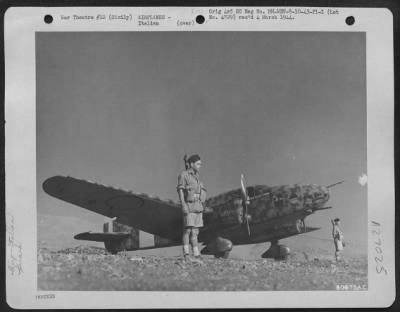 Thumbnail for Consolidated > An Italian Bergamaschi "Ghibli," twin-engine light general purpose monoplane, which landed at Palermo, Sicily on 10 September 1943 after the news of the capitulation of Italy, is shown being guarded by two British soldiers.