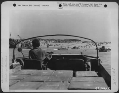 Thumbnail for Consolidated > A "duck," carrying cases of .50 cal. Ammunition, heads for the shore during landing operations near Gela, Sicily, in July 1943.