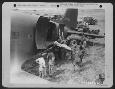 Thumbnail for Consolidated > A litter patient is loaded aboard a Douglas C-47 at Agrigento, Sicily, for evacuation to Africa for medical treatment. 25 July 1943.