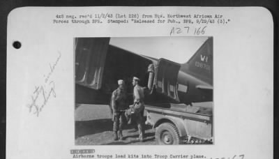 Thumbnail for Consolidated > Airborne troops load kits into Troop Carrier plane.