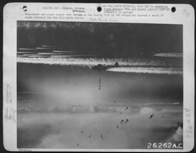 Consolidated > Flak-burst and vapor trails over Bremen as the Boeing B-17 in the foreground unloads a stick of bombs destined for the ship yards below.