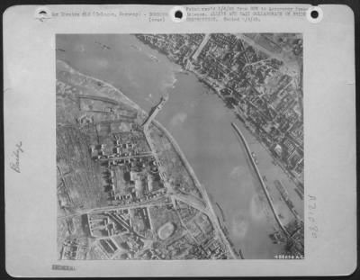 Consolidated > The Germans deserve a share of the credit for the destruction of this highway bridge at Cologne, Germany, shown here in a photograph taken by a U.S. Army 9th Air force Reconnaissance pilot. Despite the evidence of numerous craters in the vicinity