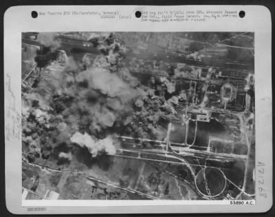 Thumbnail for Consolidated > Formerly making motor transport and aircraft wings, German plant at Fallersleben, shown under attack 5 Aug 44 by 8th AF heavy bombers, is now believed to be manufacturing fuselages and other parts for robot bombs. This plant is located about 20 miles