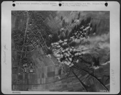 Consolidated > The vital choke opint and half the yards receive the solid impact of a tight cluster of bombs, as the first group of U.S. 8th AF heavy bombers score lifts on the target from 25,000 ft., during the attack of 4 Dec 44. Other targets for the day
