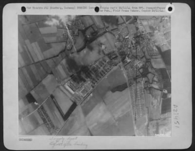 Consolidated > The large Nazi ordnance plant just outside of Hamburg, Germany, is pictured just before U.S. 8th heavy bombers dropped concentrations of bombs there 6 Oct 44 in a daylight assault.