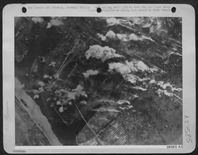 Thumbnail for Consolidated > Bomb bursts and explosions in the Rhenania-Ossag and Ebano oil refineries at Harburg, Germany are shown during the attack by Consolidated B-24 Liberators, 17 Jan 45. Meanwhile, other oil refineries in nearby Hamburg were under attack by 8th AF heavy