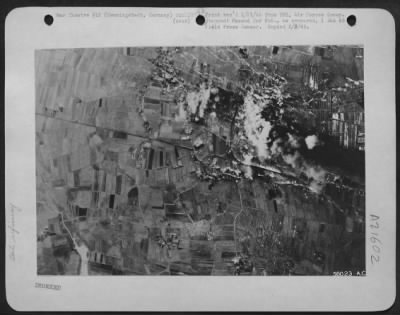 Thumbnail for Consolidated > Erupting bombs spread havoc at the German oil refinery at Hemmingstedt, Germany during the concentrated attack 14 January 1945, by U.S. 8th Air Force Consolidated B-24 Liberators. Billowing smoke marks tell-tale fires in the plant.