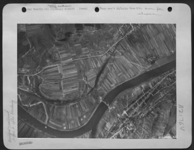 Thumbnail for Consolidated > The Konz-Karthaus rail bridge over the Moselle Rover, five miles southwest of Trier, Germany as it appeared a few seconds before the U.S. Army 9th Air Force Marauders bombed the span, an important link in the movement of enemy supplies and troops to