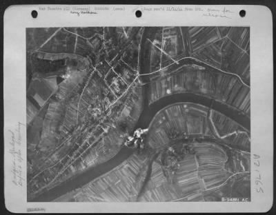 Thumbnail for Consolidated > Bomb bursts completely cover the Konz-Karthaus rail bridge over the Moselle River, five miles southwest of Trier, Germany, after it was bombed by U.S. Army 9th Air Force Marauders.