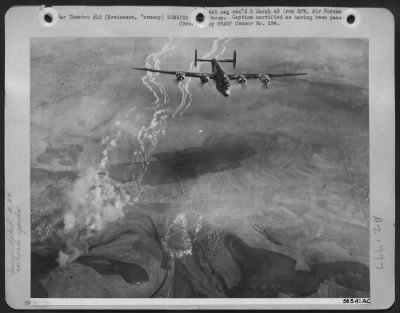 Thumbnail for Consolidated > Bombing at levels less than 10,000 feet, Consolidated B-24 Liberators of the U.S. Eighth Air Force pounded Nazi communications centers throughout Germany 22 Feb 45, in a large scale daylight operation. Here a Liberator passes over the burning