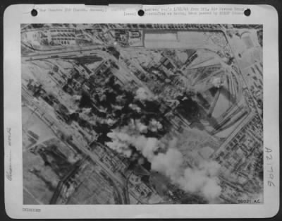 Consolidated > First bombs from Consolidated B-24 Liberators of the 8th Air Force, burst squarely in the target area of the Lauta, Germany, aluminum plant, 16 January 1945.