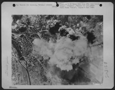 Thumbnail for Consolidated > One of three important rail yards hit in precision attacks by Marauders and Invaders of Maj. Gen. Samuel E. Anderson's medium bomber force on 25 March 1945, the yard at Limburg, Germany is seen here with smoke billowing skyward. All lines were