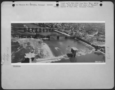 Thumbnail for Consolidated > Blasted Bridges Reflect The Fury Of Allied Air Attack And The Swiftness Of German Retreat In Western Germany.  Over The Moselle River At Coblenz, Germany, The Old Road Bridge Is Partly Destroyed From Air, Lutzel Rail Bridge Was Hit By 8Th & 9Th Af, Finish