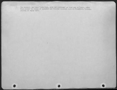Consolidated > The Germans, Who Once 'Rode Hige, Wide And Handsome' As They Say In Texas, Today Walk Around The Ruins Of Upturned And Blasted Railroad Cars At Frankfurt, Germany, Pulling An Empty Cart.