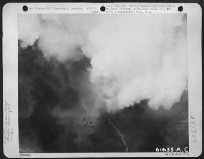 Thumbnail for Consolidated > Following The Same Path As The 'Marker' Bomb, High Explsoives Dropped By Boeing B-17 Flying Fortresses Of The 452Nd Bomb Group Cascade Into A Dense Layer Of Clouds Over The Target, Frankfurt, Germany, On 20 March 1944.  The Bomber Formation Remained Above