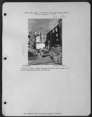 Consolidated > Aviation Writer, Wayne Parrish Standing Amid Ruins Of A German Apartment House In Hamburg.