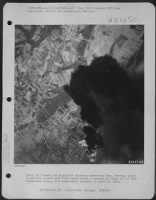 Thumbnail for Bombs Fall Toward The Ingolstadt Kosching Ammunition Dump, Germany, Which Is Already Covered With Bomb Bursts During A Mission By Planes Of The 17Th Bomb Group, 34Th Bomb Squardon On April 20 1945. - Page 1