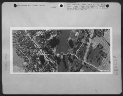 Thumbnail for Consolidated > Prize Exhibit Of The Burma Azon Bombers Is This Strike Photo Showing Three Azons Hitting Smak Along The Middle Of Taungup Road Bridge While Uncontrolled Bombs Miss.  The B-24S Left The Bridge Impassable With Three Big Gaps.