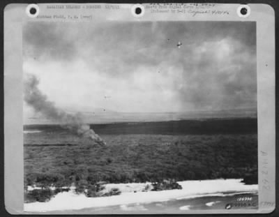 Thumbnail for Consolidated > Hawiian Islands - Bombing 12/7/41. Hickam Field, T.H. One Of The First Army Photos Of The Bombing Of Hickam Field, Hawaii, Dec. 7 1941. Unidentified Planes Circle In Combat.