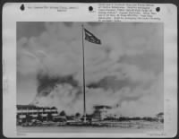 Pearl Harbor Flag Flies At Hickam Field -- The Garrison Flag, Pictures, Which Flew Over Hickam Field, Hawaii, On December 7, 1941 At The Time Of The Japanese Attack, Was Raised Again At 7:55 Am Today (Hawaii Time) In Special Ceremonies At The Hawaiian Bas - Page 1