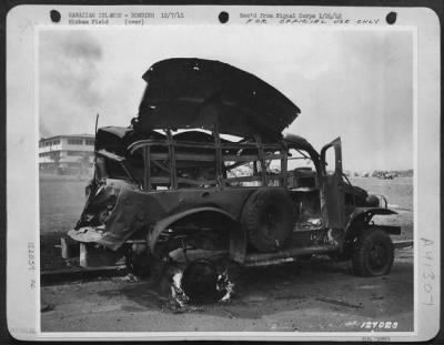 Thumbnail for Consolidated > First Army Photos Of The Bombing Of Hickam Field, Hawaii, Dec. 7, 1941.  Bombed Truck Still Bruning Off Hickam Parade Ground, 'F' Street At 11:15 A.M.