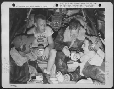 Thumbnail for Consolidated > Returning From Raid Over Wake Island, On 30 April 1944, Crew Members On The Consolidated B-24 Liberator 'Kansas Cyclone', Relax As They Sip Canned Grapefruit Juice. 26Th Bomb Squadron, 11Th Bomb Group, 7Th Bomber Command.