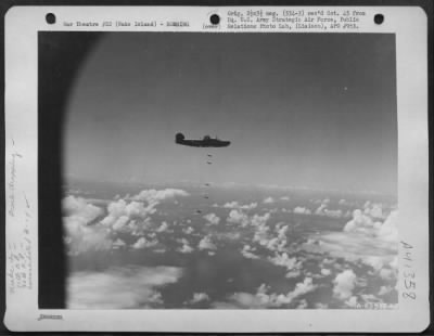 Thumbnail for Consolidated > Bombs Fall From Consolidated B-24 Liberator During Raid Over Wake Island On 30 April 1944.  Airplanes Of The 11Th And 30Th Bomb Groups, 7Th Bomber Command, Participated In This Raid.