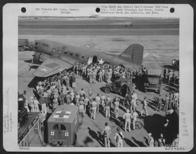 Thumbnail for Consolidated > Men Gather Around A Douglas C-47 Which Has Just Landed At Hickam Field, Oahu, Hawaii.  The Plane Evacuated Wounded From The Battle Of Midway, 7 June 1942.