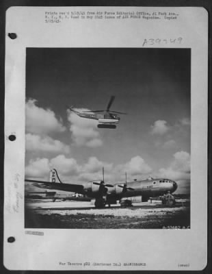 Thumbnail for Consolidated > Sikorsky R-4B Helicopter Hovers Over A Giant B-29 Which Operates Against The Japanses Mainland.  The Helicopter Carries Small Parts Which Have Been Repaired Aboard The Repair Ship And Brings Them To The Bomber For Installation.  Marianas Islands