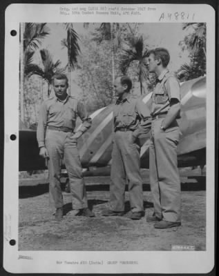Groups > Prior To A Fighter Mission, Colonel P. Cochran, Colonel John Alison And Lt. Colonel Arvid Olson, 1St Air Commando Force Operations Officer, Discuss The Mission.  In The Background Is A North American P-51 "Mustang", Painted With The Stripes That Identifie