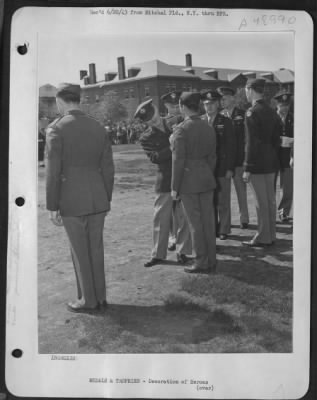 Thumbnail for Groups > 'Unremitting Vigil' Of Technical Sergeant Donald E. Lahmers And 50 Other Officers And Men Of The Anti-Submarine Command Was Hailed At Mitchel Field, New York, Ceremonies By Brigadier General Westside R. Larson. The General, Shown Pinning The Air Medal On