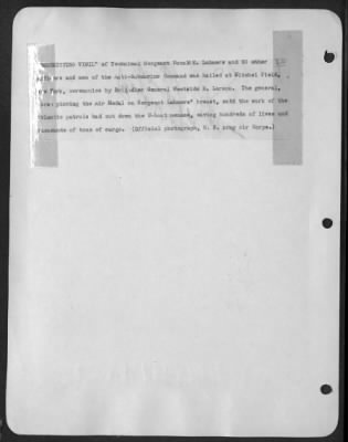 Groups > 'Unremitting Vigil' Of Technical Sergeant Donald E. Lahmers And 50 Other Officers And Men Of The Anti-Submarine Command Was Hailed At Mitchel Field, New York, Ceremonies By Brigadier General Westside R. Larson. The General, Shown Pinning The Air Medal On