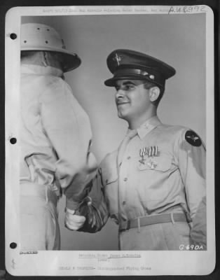 Thumbnail for Groups > Aviation Cadet James M. Kokales - A Veteran Of 61 Combat Missions In Flying Fortresses As An Enlisted Man, Aviation Cadet James M. Kokales Of Oakmont, Pa., Receives A Handshake Form Colonel Michael F. Davis, Commanding Officer Of The San Antonio Aviation