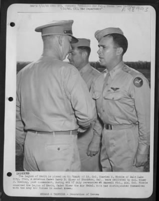 Groups > The Legion Of Merit Is Pinned On The Breast Of Lt. Colonel Charles B. Winkle Of Salt Lake City, Utah, & Aviation Cadet Harry D. Miser Of Stockton, Cal., Were Decorated By Colonel Elmer J. Bowling, Post Commandant, During 4Th Of July Ceremonies At Maxwell