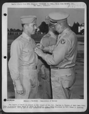 Thumbnail for Groups > The Legion Of Merit Is Pinned On The Breast Of Lt. Colonel Charles B. Winkle Of Salt Lake City, Utah, & Aviation Cadet Harry D. Miser Of Stockton, Cal., Were Decorated By Colonel Elmer J. Bowling, Post Commandant, During 4Th Of July Ceremonies At Maxwell