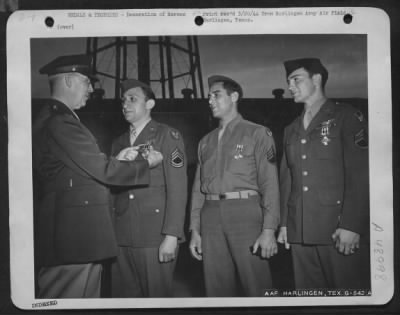 Groups > Harlingen Army Air Field, Texas - Three Aerial Gunnery Instructors Stationed At The Harlingen Army Air Field, All Combat Veterans, Received Distinguished Flying Crosses Wednesday Afternoon From Brig. Gen. Martinus Stenseth (Extreme Left) During Retreat Ce