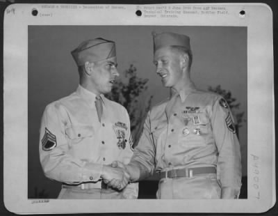 Thumbnail for Groups > Two South Pacific Vets Honored, Buckley Field, Colo. - Veterans Of The Aerial Warfare Against The Japanese In The Pacific, S/Sgts. Leroy A. Schichner Of Chicago, Illinois, (Left) And Robert J. Collings Of Pawtucket, Tenn., Congratulate Each Other On The H