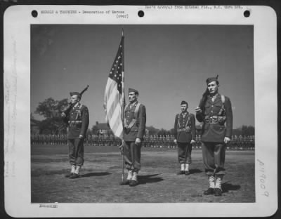 Thumbnail for Groups > Color Guard And Air Base Squadron Stand At Attention During Mitchel Field, New York, Ceremonies, Honoring 51 Officers And Men Of The Anti-Submarine Command For Atlantic Patrol. Technical Sergeant William Cappilino Is Color-Bearer, Flanked By Staff Sergean