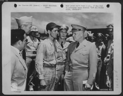 Thumbnail for Groups > 'How Are Things Going, Sergeant'? The Answer Might Be 'Not So Good', Judging From The Expression On Sgt. Julian Ridgeway'S Face, During A Conversation He Had With General Eisenhower During The Latter'S Recent Visit To Hickam Field, Hawaii. Ridgeway Is Cre