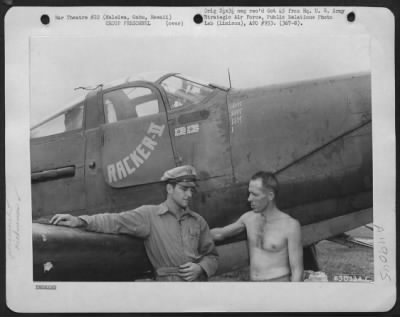 Thumbnail for Groups > 1St Lt. J. H. Carlyle Of Gilroy, Calif., Chats With Sgt. E. J. Brown Of Toledo, Ohio Besides The Bell P-39 'Racker Ii'. Lt. Carlyle Shot Down Two Japanese Plane Over Makin Island. Haleiwa, Oahu, Hawaii.